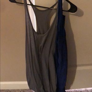 One gray and one blue stringer workout shirt.